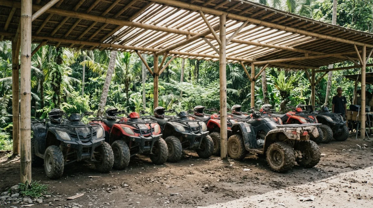Row of quad bikes lined up at an Ubud ATV tour base before departure, gear laid out beside them